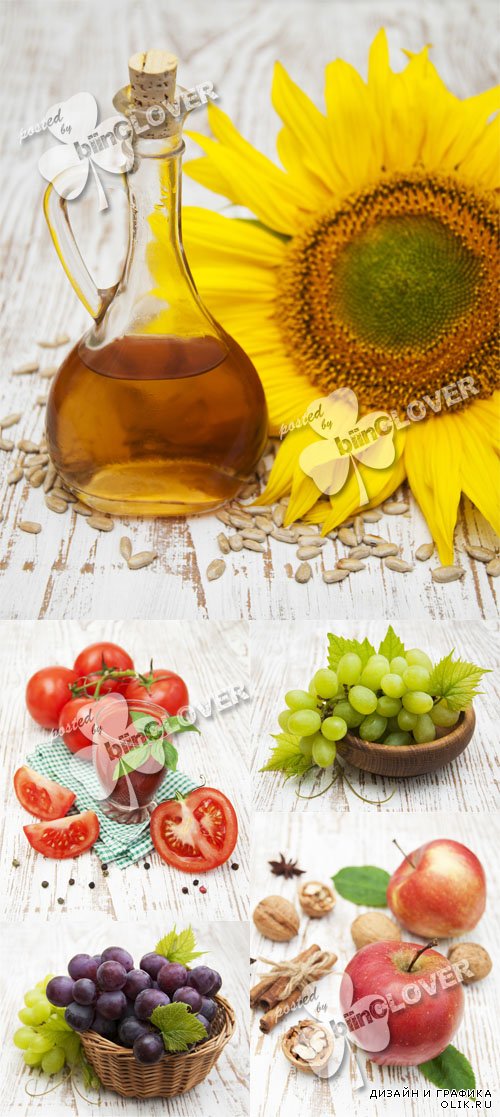 Still life with sunflowers, sunflower oil, grapes, apples and tomatoes on a wooden background 0598