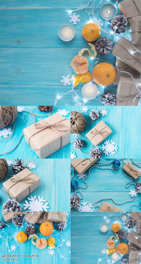 Photo Kraft gift boxes, garland, candles, mandarins , snowflakes, Christmas decorations, cones on the wooden blue